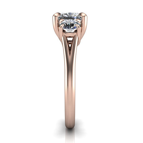 Jasmine cushion three stone engagement ring in 14K Rose Gold with round side stones, side profile showing the plain band and split under-gallery
