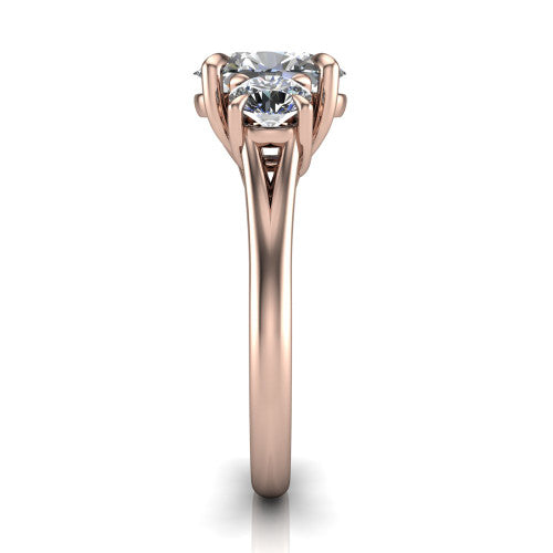 Jasmine oval three stone engagement ring in 14K Rose Gold with round side stones, side profile showing the plain band and split under-gallery