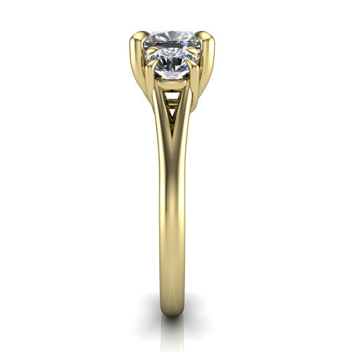 Jasmine cushion three stone engagement ring in 14K Yellow Gold with round side stones, side profile showing the plain band and split under-gallery