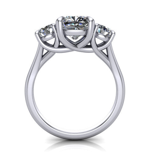 Jasmine cushion three stone engagement ring in Platinum with round side stones, through-finger front profile