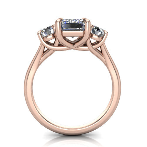 Jasmine emerald three stone engagement ring in 14K Rose Gold with round side stones, through-finger front profile