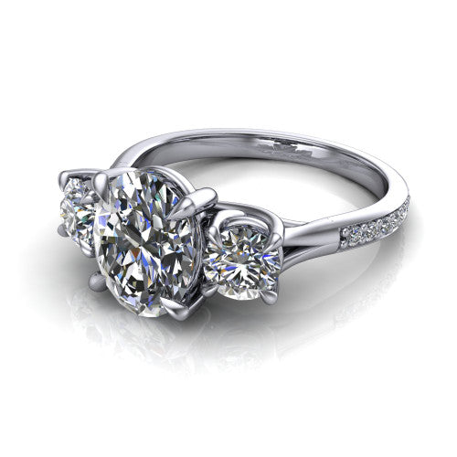 Ruth oval three stone engagement ring in 14K White Gold, three-quarter perspective showing the oval center between two round side stones above a pav&eacute; band