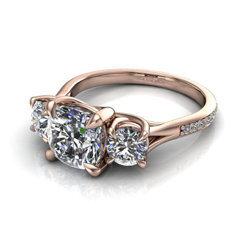 Ruth cushion three stone engagement ring in 18K Rose Gold, three-quarter perspective showing the cushion center between two round side stones above a pav&eacute; band