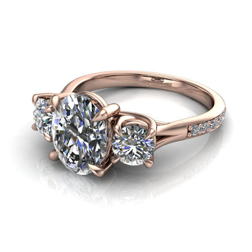 Ruth oval three stone engagement ring in 14K Rose Gold, three-quarter perspective showing the oval center between two round side stones above a pav&eacute; band