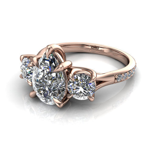 Ruth pear three stone engagement ring in 14K Rose Gold, three-quarter perspective showing the pear center between two round side stones above a pav&eacute; band