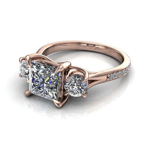 Ruth princess three stone engagement ring in 14K Rose Gold, three-quarter perspective showing the princess center between two round side stones above a pav&eacute; band