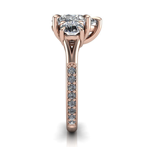 Ruth pear three stone engagement ring in 18K Rose Gold, side profile showing the pav&eacute; band and the three-stone setting in profile