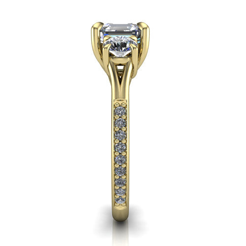 Ruth square emerald three stone engagement ring in 18K Yellow Gold, side profile showing the pav&eacute; band and the three-stone setting in profile