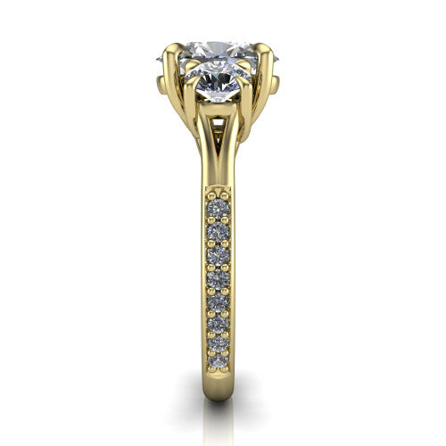 Ruth oval three stone engagement ring in 18K Yellow Gold, side profile showing the pav&eacute; band and the three-stone setting in profile