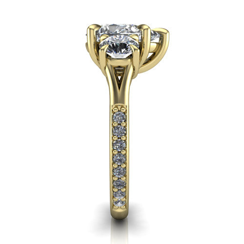 Ruth pear three stone engagement ring in 18K Yellow Gold, side profile showing the pav&eacute; band and the three-stone setting in profile