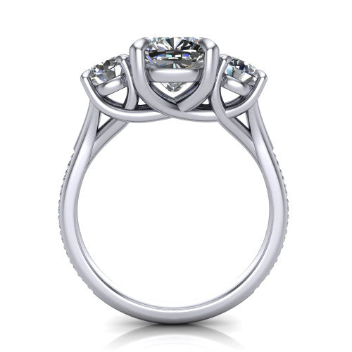 Ruth cushion three stone engagement ring in Platinum, through-finger front profile showing the three-stone head and scrolled gallery above the pav&eacute; band