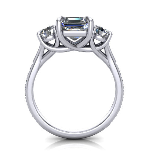 Ruth square emerald three stone engagement ring in Platinum, through-finger front profile showing the three-stone head and scrolled gallery above the pav&eacute; band