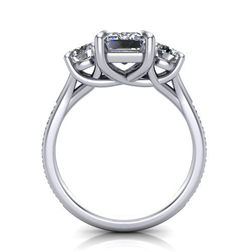 Ruth emerald three stone engagement ring in 18K White Gold, through-finger front profile showing the three-stone head and scrolled gallery above the pav&eacute; band