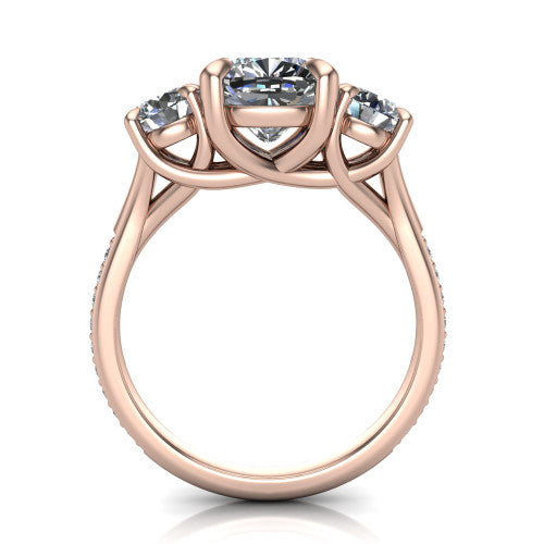 Ruth cushion three stone engagement ring in 14K Rose Gold, through-finger front profile showing the three-stone head and scrolled gallery above the pav&eacute; band