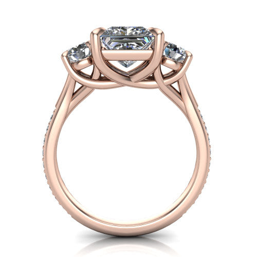 Ruth princess three stone engagement ring in 18K Rose Gold, through-finger front profile showing the three-stone head and scrolled gallery above the pav&eacute; band