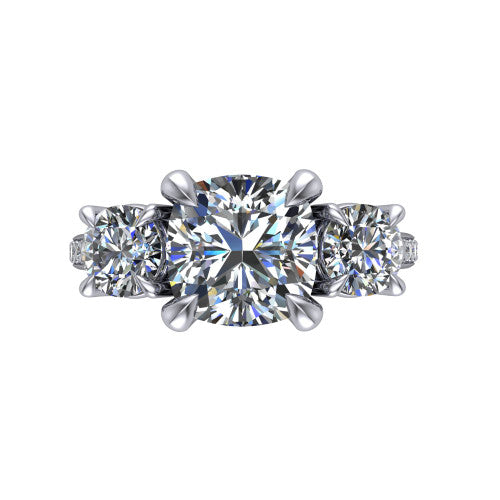 Ruth cushion three stone engagement ring in Platinum, top-down view showing the cushion center flanked by two round accent diamonds