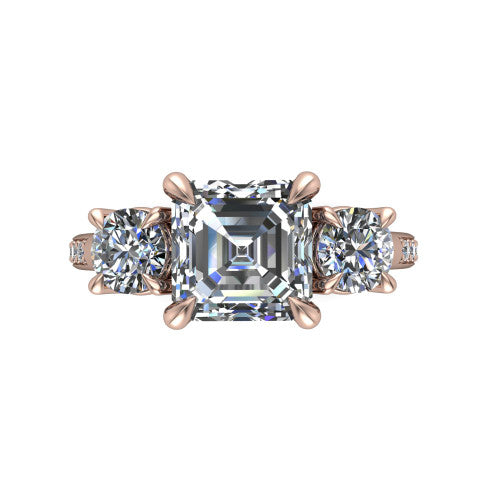 Ruth square emerald three stone engagement ring in 18K Rose Gold, top-down view showing the square emerald center flanked by two round accent diamonds