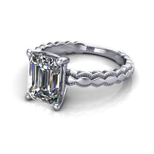 Flora emerald solitaire engagement ring in 18K White Gold, three-quarter perspective showing the emerald center on claw prongs above a scalloped beaded milgrain band