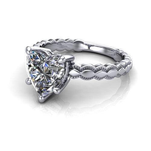 Flora heart solitaire engagement ring in 14K White Gold, three-quarter perspective showing the heart center on claw prongs above a scalloped beaded milgrain band
