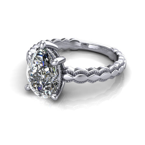 Flora pear solitaire engagement ring in 18K White Gold, three-quarter perspective showing the pear center on claw prongs above a scalloped beaded milgrain band