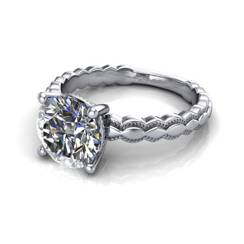 Flora round solitaire engagement ring in 14K White Gold, three-quarter perspective showing the round center on claw prongs above a scalloped beaded milgrain band