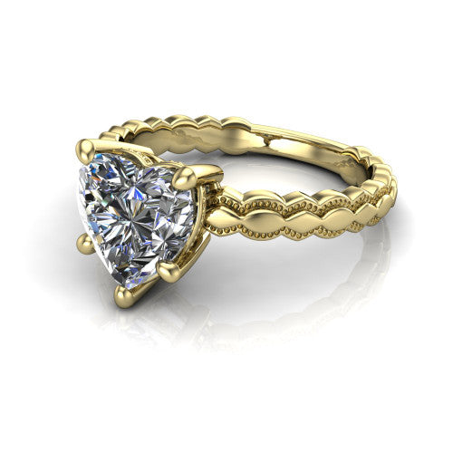 Flora heart solitaire engagement ring in 14K Yellow Gold, three-quarter perspective showing the heart center on claw prongs above a scalloped beaded milgrain band