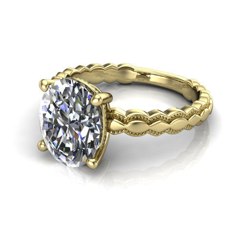 Flora oval solitaire engagement ring in 18K Yellow Gold, three-quarter perspective showing the oval center on claw prongs above a scalloped beaded milgrain band