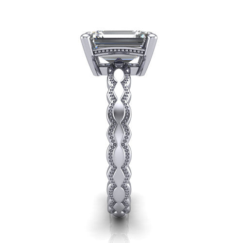 Flora emerald solitaire engagement ring in 14K White Gold, side profile showing the scalloped milgrain band and the open basket beneath the emerald center