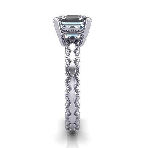 Flora square emerald solitaire engagement ring in 14K White Gold, side profile showing the scalloped milgrain band and the open basket beneath the square emerald center