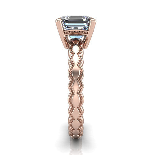 Flora square emerald solitaire engagement ring in 18K Rose Gold, side profile showing the scalloped milgrain band and the open basket beneath the square emerald center