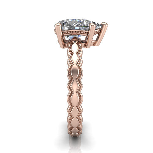 Flora pear solitaire engagement ring in 18K Rose Gold, side profile showing the scalloped milgrain band and the open basket beneath the pear center
