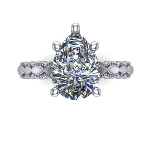 Flora pear solitaire engagement ring in Platinum, top-down view showing the pear center and the scalloped openwork band