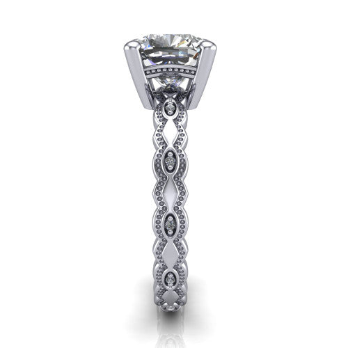 Ivy cushion solitaire engagement ring in Platinum, side profile showing the milgrain marquise shapes and bezel-set round accents around the shank