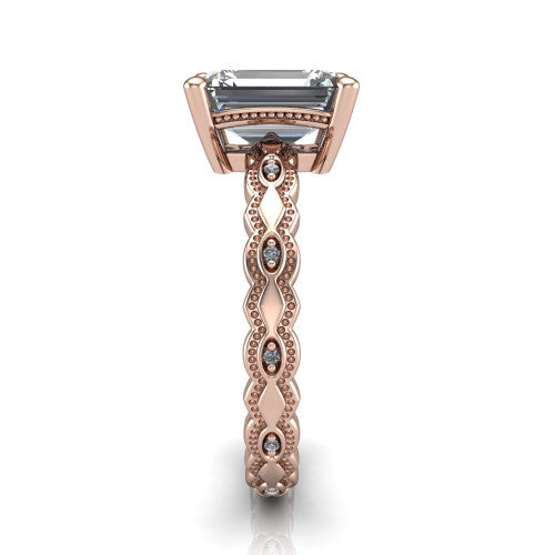 Ivy emerald solitaire engagement ring in 18K Rose Gold, side profile showing the milgrain marquise shapes and bezel-set round accents around the shank