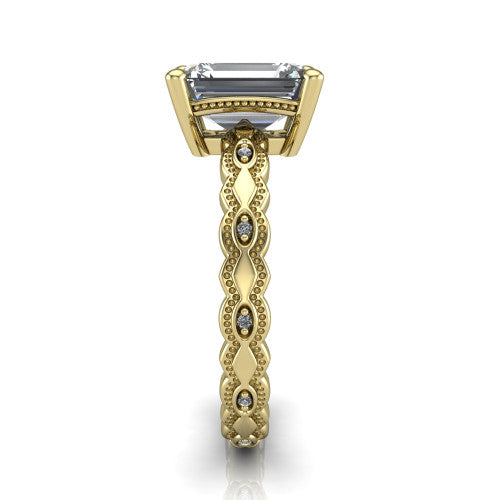 Ivy emerald solitaire engagement ring in 14K Yellow Gold, side profile showing the milgrain marquise shapes and bezel-set round accents around the shank