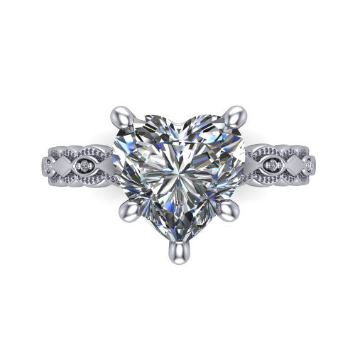 Ivy heart solitaire engagement ring in Platinum, top-down view showing the prong-set center diamond over a patterned milgrain eternity band