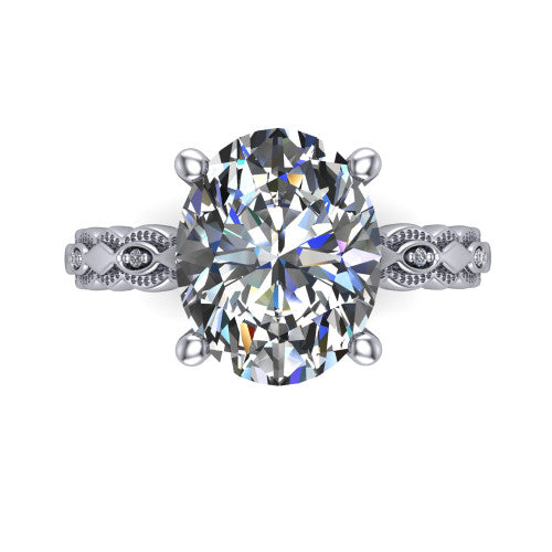 Ivy oval solitaire engagement ring in 18K White Gold, top-down view showing the prong-set center diamond over a patterned milgrain eternity band