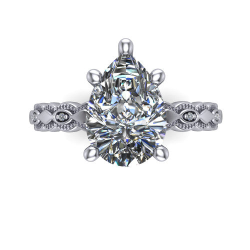 Ivy pear solitaire engagement ring in 14K White Gold, top-down view showing the prong-set center diamond over a patterned milgrain eternity band