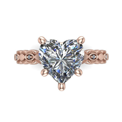 Ivy heart solitaire engagement ring in 18K Rose Gold, top-down view showing the prong-set center diamond over a patterned milgrain eternity band
