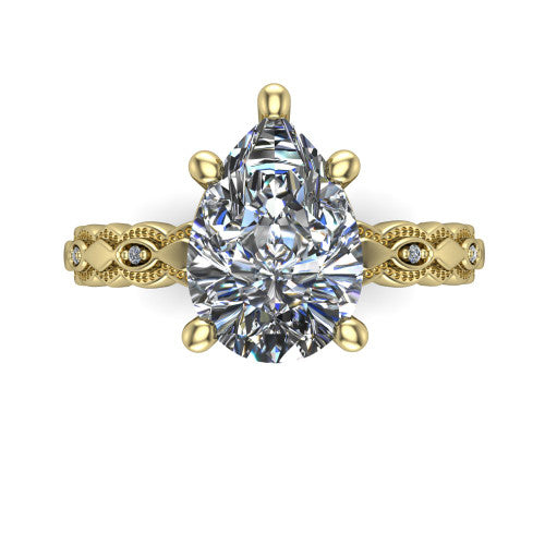 Ivy pear solitaire engagement ring in 14K Yellow Gold, top-down view showing the prong-set center diamond over a patterned milgrain eternity band