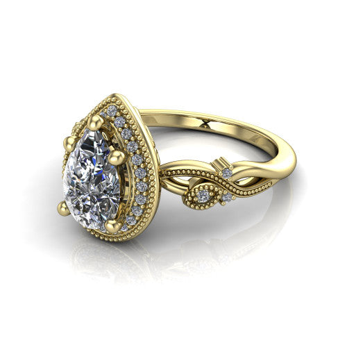 Eliana pear halo engagement ring in 14K Yellow Gold, three-quarter perspective showing the milgrain-edged halo center above vintage filigree scroll shoulders