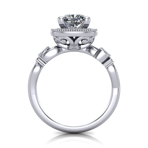 Eliana cushion halo engagement ring in Platinum, through-finger front profile showing the halo head raised above the filigree scroll shoulders