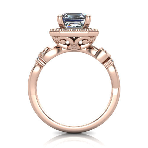 Eliana emerald halo engagement ring in 18K Rose Gold, through-finger front profile showing the halo head raised above the filigree scroll shoulders