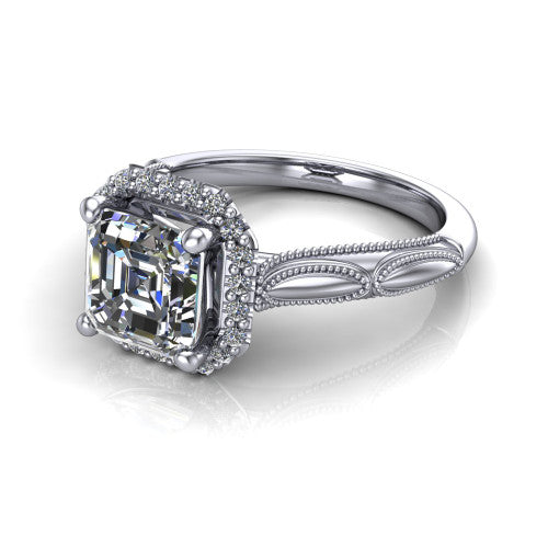 Caroline square emerald vintage halo engagement ring in Platinum, three-quarter perspective showing the square emerald center in a squared pav&eacute; milgrain halo above an openwork split shank