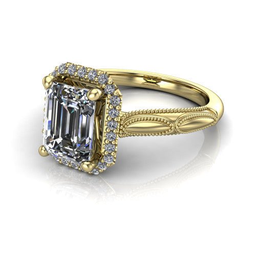 Caroline emerald vintage halo engagement ring in 18K Yellow Gold, three-quarter perspective showing the emerald center in a squared pav&eacute; milgrain halo above an openwork split shank