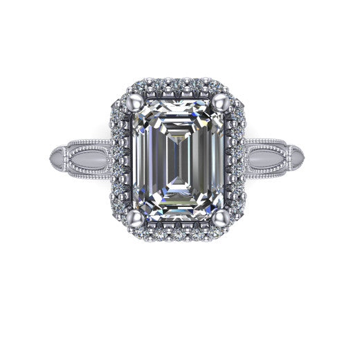 Caroline emerald vintage halo engagement ring in 18K White Gold, top-down view showing the squared pav&eacute; halo framing the emerald center with milgrain edges