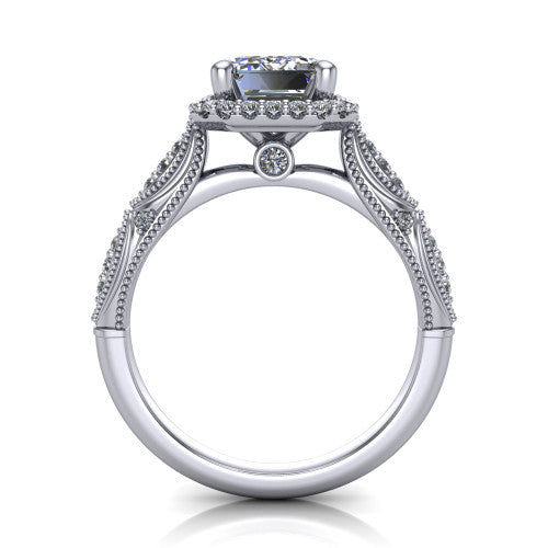 Jenna emerald vintage halo engagement ring in Platinum, through-finger front profile showing the halo head and milgrain gallery with a bezel accent above the pav&eacute; band