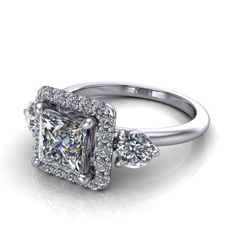 Carol princess three stone halo engagement ring in Platinum, three-quarter perspective showing the princess center in a squared pav&eacute; halo flanked by two round side stones above a plain band