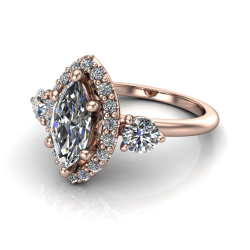 Carol marquise three stone halo engagement ring in 14K Rose Gold, three-quarter perspective showing the marquise center in a squared pav&eacute; halo flanked by two round side stones above a plain band
