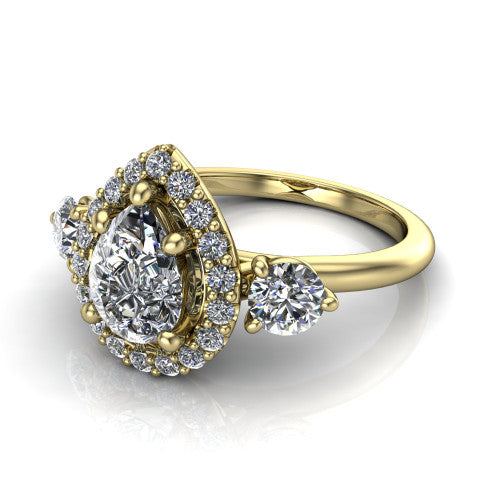 Carol pear three stone halo engagement ring in 14K Yellow Gold, three-quarter perspective showing the pear center in a squared pav&eacute; halo flanked by two round side stones above a plain band